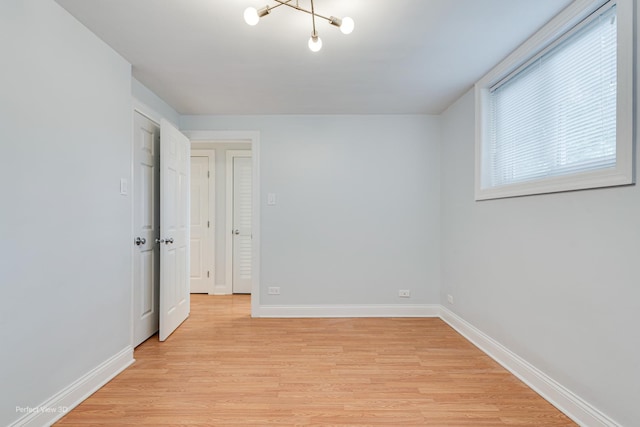 2624 W Catalpa Ave Unit 14, Chicago, IL 60625 - unfurnished room with light wood finished floors and healthy amount of natural light