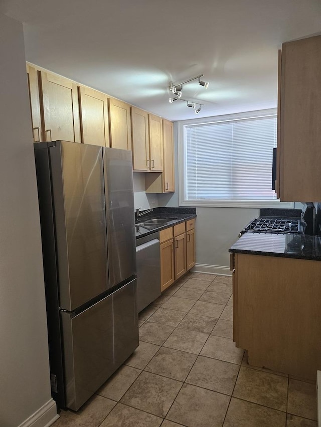 2624 W Catalpa Ave Unit 14, Chicago, IL 60625 - kitchen featuring stainless steel appliances, dark countertops, light tile patterned floors, and light brown cabinets