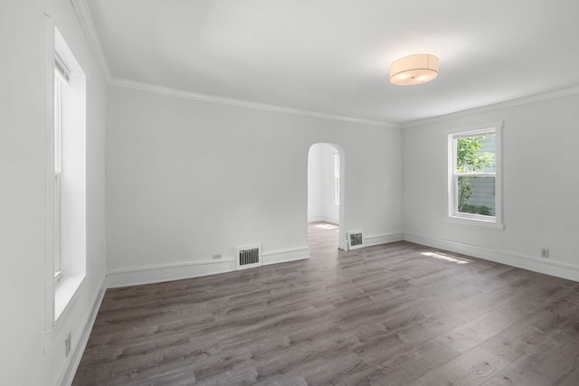 3225 Gilead Ave, Zion, IL 60099 - spare room with arched walkways, crown molding, and wood finished floors