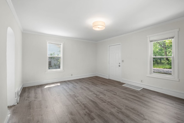3225 Gilead Ave, Zion, IL 60099 - empty room featuring wood finished floors, crown molding, and arched walkways