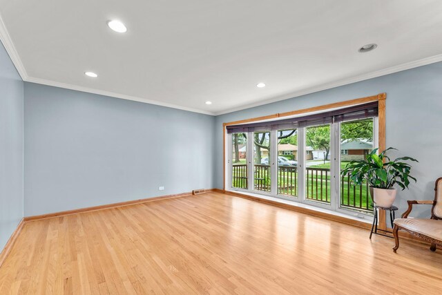 7446 Lake St, Morton Grove, IL 60053 - empty room with light wood-style flooring, recessed lighting, and crown molding