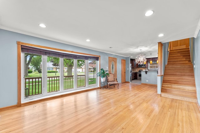 7446 Lake St, Morton Grove, IL 60053 - unfurnished living room with ornamental molding, recessed lighting, a chandelier, stairs, and light wood-type flooring