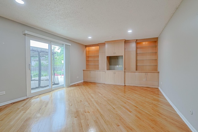 1831 E Camp Mcdonald Rd Unit 0, Mount Prospect, IL 60056 - unfurnished living room featuring light wood-style floors, a textured ceiling, and recessed lighting