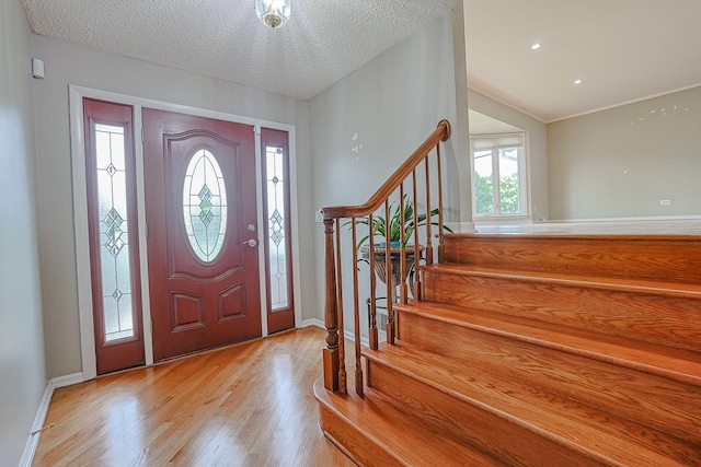 1831 E Camp Mcdonald Rd Unit 0, Mount Prospect, IL 60056 - entryway with wood finished floors, stairway, and a textured ceiling