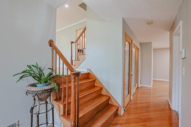 1831 E Camp Mcdonald Rd Unit 0, Mount Prospect, IL 60056 - stairs with wood finished floors and a textured ceiling