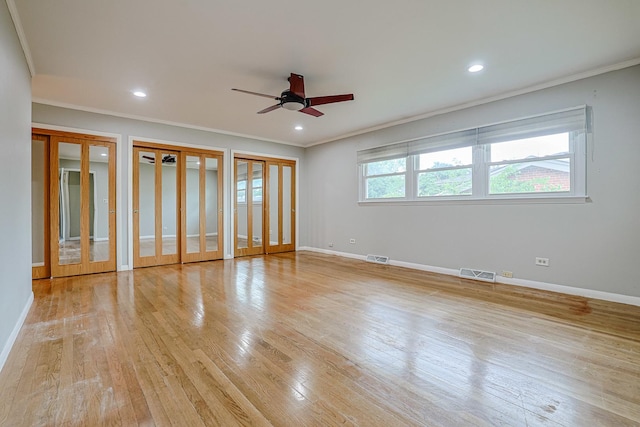 1831 E Camp Mcdonald Rd Unit 0, Mount Prospect, IL 60056 - unfurnished bedroom featuring crown molding, two closets, light wood finished floors, recessed lighting, and a ceiling fan