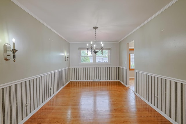 1831 E Camp Mcdonald Rd Unit 0, Mount Prospect, IL 60056 - empty room featuring a chandelier, wood finished floors, and crown molding