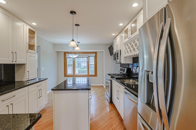 1831 E Camp Mcdonald Rd Unit 0, Mount Prospect, IL 60056 - kitchen featuring stainless steel appliances, recessed lighting, light wood-style flooring, white cabinetry, and glass insert cabinets