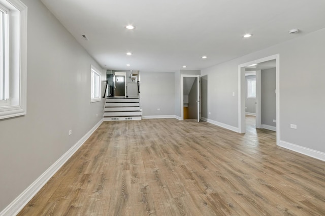 15245 Narcissus Ct, Orland Park, IL 60462 - unfurnished living room with recessed lighting, stairs, and light wood-type flooring