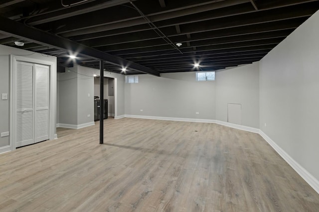 15245 Narcissus Ct, Orland Park, IL 60462 - basement featuring light wood-type flooring and baseboards