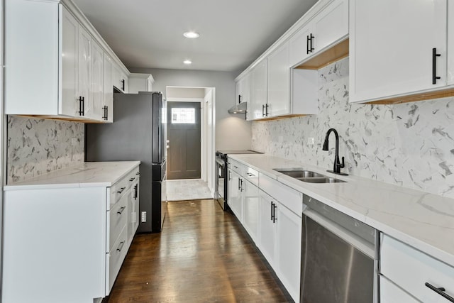 15245 Narcissus Ct, Orland Park, IL 60462 - kitchen featuring appliances with stainless steel finishes, under cabinet range hood, tasteful backsplash, dark wood finished floors, and light stone counters
