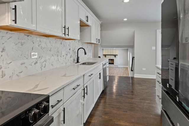 15245 Narcissus Ct, Orland Park, IL 60462 - kitchen featuring range, recessed lighting, dark wood-style flooring, white cabinets, and tasteful backsplash