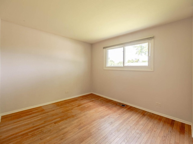 2134 S Hull Dr, Wheaton, IL 60189 - unfurnished room with light wood-style flooring and baseboards