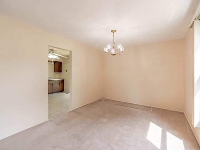 2134 S Hull Dr, Wheaton, IL 60189 - spare room with light colored carpet, a chandelier, and ceiling fan