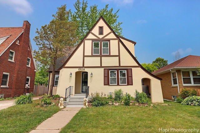 1504 W Monroe St, Waukegan, IL 60085 - tudor home with stucco siding and a front lawn