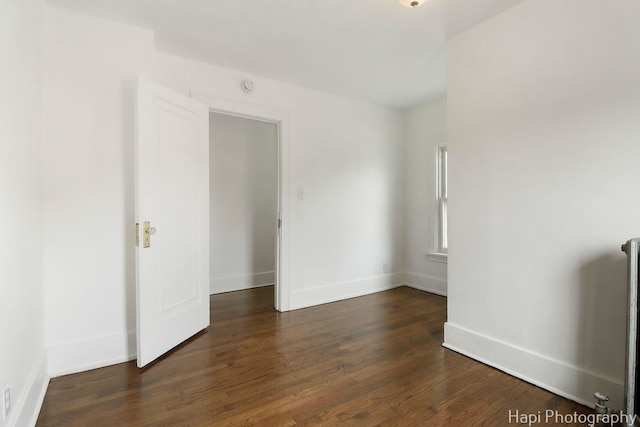 1504 W Monroe St, Waukegan, IL 60085 - spare room with wood finished floors and a smoke detector