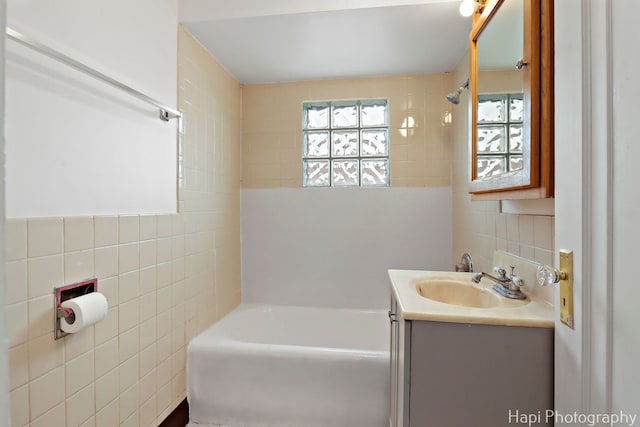 1504 W Monroe St, Waukegan, IL 60085 - full bath featuring tile walls, vanity, and bathing tub / shower combination