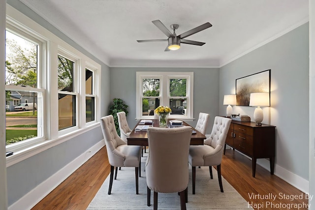 1504 W Monroe St, Waukegan, IL 60085 - dining space featuring plenty of natural light, wood finished floors, a ceiling fan, and ornamental molding