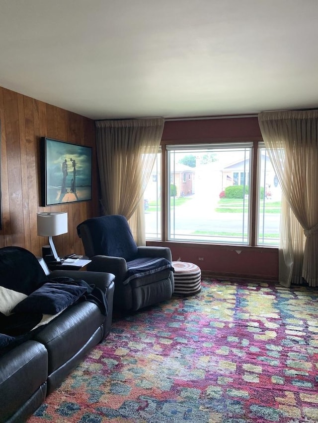 7609 W Gunnison St, Harwood Heights, IL 60706 - carpeted living room with plenty of natural light and wooden walls