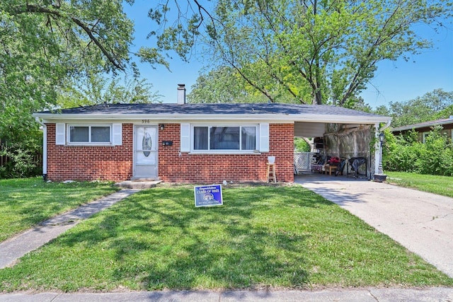 396 Thelma Ct, Wheeling, IL 60090 - view of front facade featuring brick siding, driveway, a front yard, and an attached carport