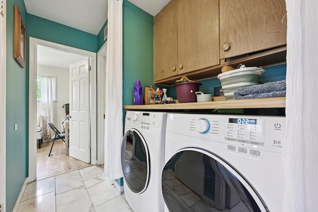 396 Thelma Ct, Wheeling, IL 60090 - washroom with washer and dryer, cabinet space, and light marble finish flooring