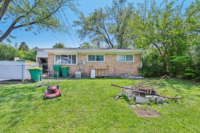 396 Thelma Ct, Wheeling, IL 60090 - back of property with a fire pit and brick siding