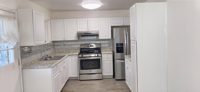 396 Thelma Ct, Wheeling, IL 60090 - kitchen featuring appliances with stainless steel finishes, under cabinet range hood, light countertops, and tasteful backsplash
