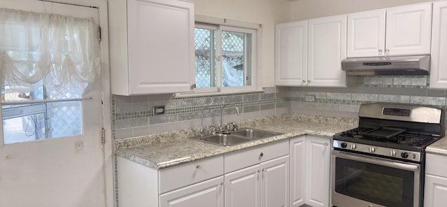 396 Thelma Ct, Wheeling, IL 60090 - kitchen featuring gas range, under cabinet range hood, and white cabinetry