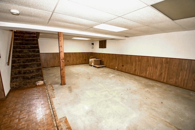 38103 N Cornell Rd, Beach Park, IL 60087 - finished below grade area featuring stairway, wooden walls, a drop ceiling, and a wainscoted wall