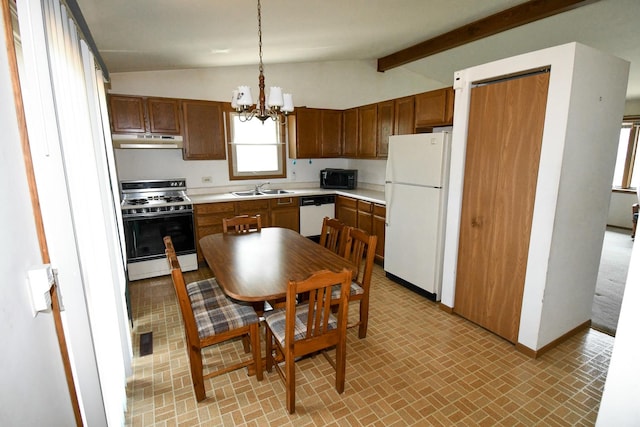 38103 N Cornell Rd, Beach Park, IL 60087 - kitchen with white appliances, under cabinet range hood, light countertops, brick patterned flooring, and a chandelier