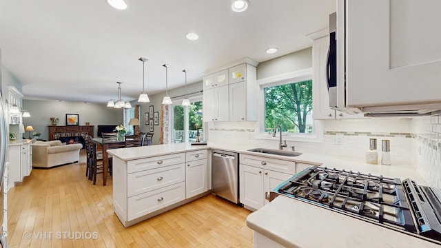 2478 Lawson Blvd, Gurnee, IL 60031 - kitchen featuring dishwasher, a peninsula, open floor plan, light countertops, and recessed lighting