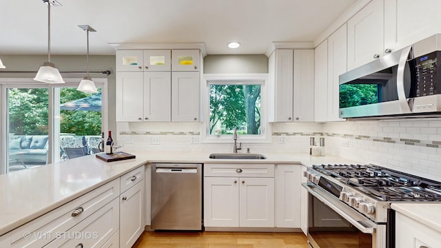 2478 Lawson Blvd, Gurnee, IL 60031 - kitchen with appliances with stainless steel finishes, white cabinets, healthy amount of natural light, and light countertops
