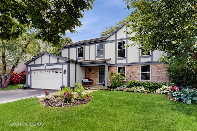 2478 Lawson Blvd, Gurnee, IL 60031 - tudor house featuring driveway, an attached garage, a front yard, and stucco siding