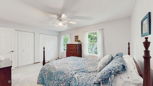 2478 Lawson Blvd, Gurnee, IL 60031 - bedroom with multiple closets, light carpet, and ceiling fan