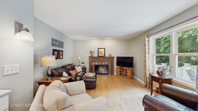 2478 Lawson Blvd, Gurnee, IL 60031 - living area featuring light wood finished floors and a fireplace