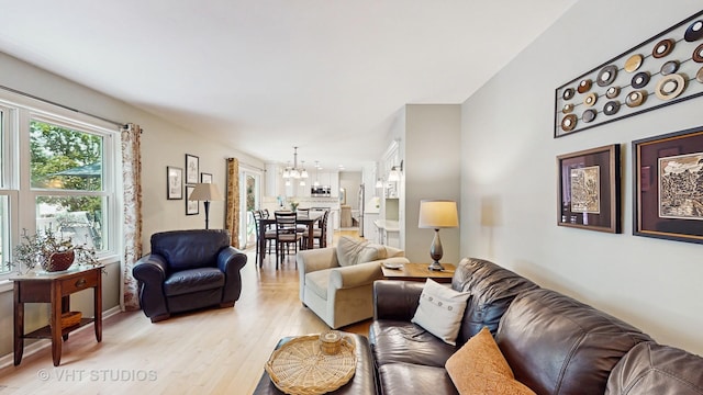2478 Lawson Blvd, Gurnee, IL 60031 - living area with a chandelier and light wood-type flooring