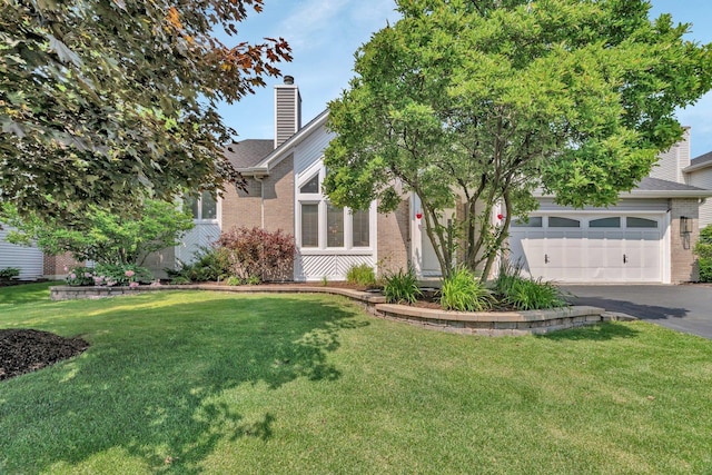 5024 Switch Grass Ln, Naperville, IL 60564 - view of property hidden behind natural elements with brick siding, asphalt driveway, a garage, a chimney, and a front lawn