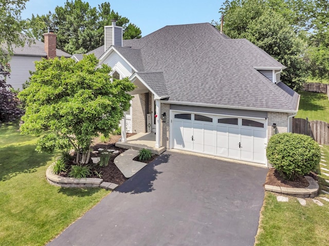 5024 Switch Grass Ln, Naperville, IL 60564 - view of front of home featuring a shingled roof, an attached garage, asphalt driveway, and brick siding