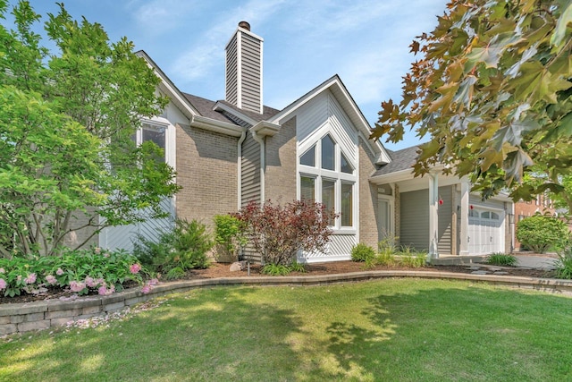 5024 Switch Grass Ln, Naperville, IL 60564 - view of front of home featuring brick siding, a front yard, a chimney, a garage, and a shingled roof