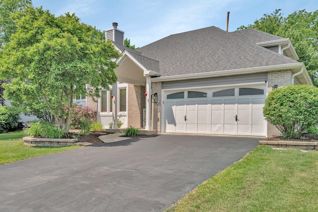 5024 Switch Grass Ln, Naperville, IL 60564 - view of front facade featuring driveway, a garage, roof with shingles, brick siding, and a chimney