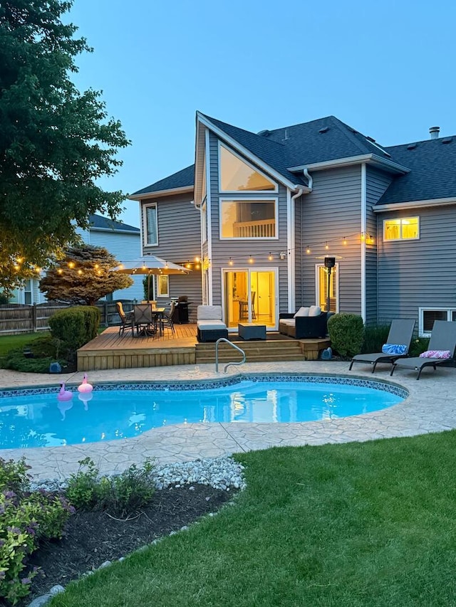 5024 Switch Grass Ln, Naperville, IL 60564 - rear view of property featuring a wooden deck, an outdoor pool, an outdoor living space, outdoor dining space, and roof with shingles