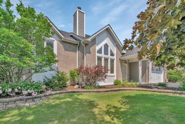 5024 Switch Grass Ln, Naperville, IL 60564 - view of front of house with brick siding, a chimney, a front yard, and a shingled roof
