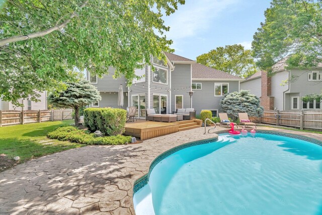 5024 Switch Grass Ln, Naperville, IL 60564 - view of pool with outdoor lounge area, a deck, and a fenced backyard