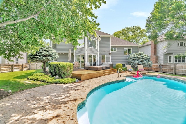 5024 Switch Grass Ln, Naperville, IL 60564 - view of pool with an outdoor hangout area, a wooden deck, and a fenced backyard