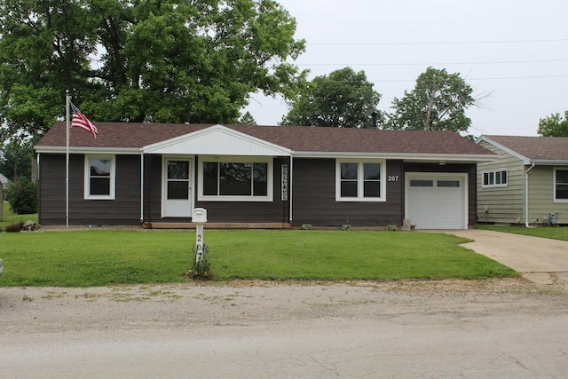 207 Cedar Dr, Clinton, IL 61727 - single story home with a garage, a front yard, driveway, and a shingled roof