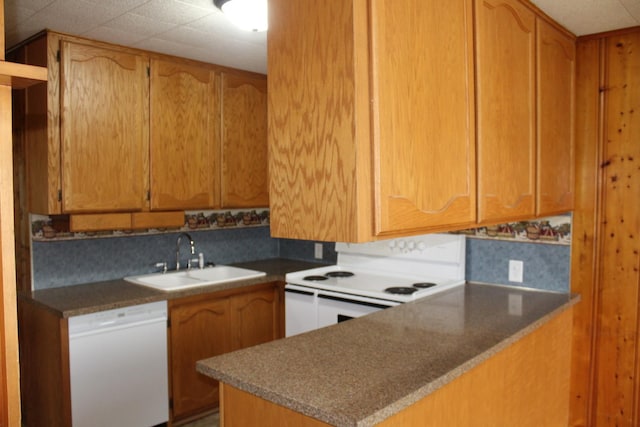 207 Cedar Dr, Clinton, IL 61727 - kitchen featuring white appliances and a peninsula