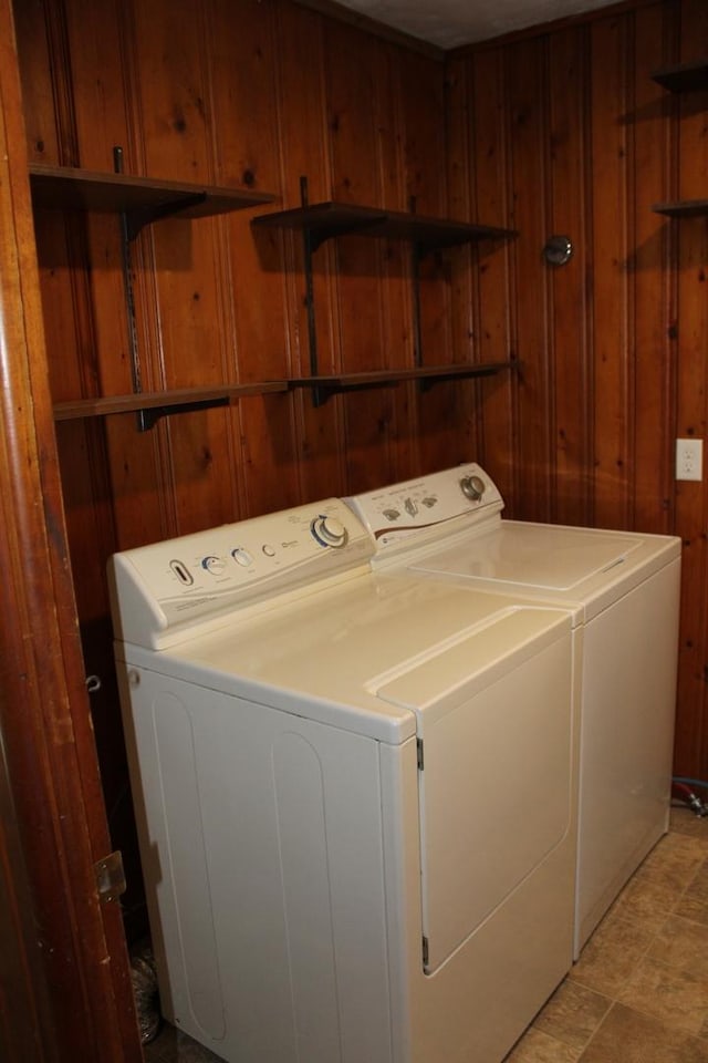 207 Cedar Dr, Clinton, IL 61727 - laundry area featuring independent washer and dryer and wooden walls