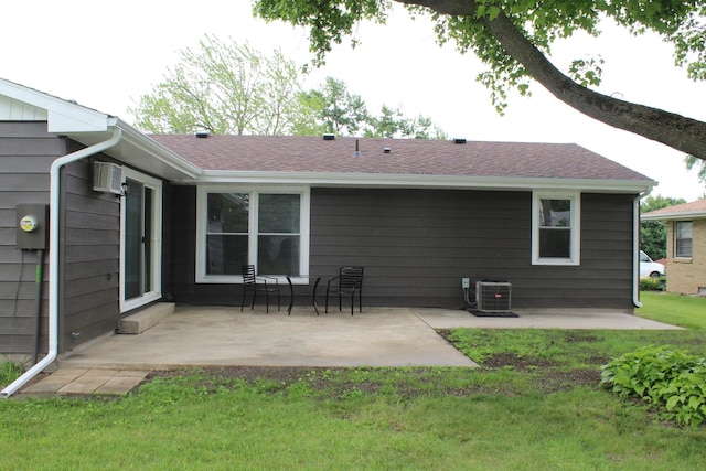 207 Cedar Dr, Clinton, IL 61727 - back of house featuring a patio and a yard