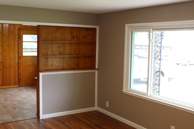 207 Cedar Dr, Clinton, IL 61727 - empty room with plenty of natural light and wood finished floors