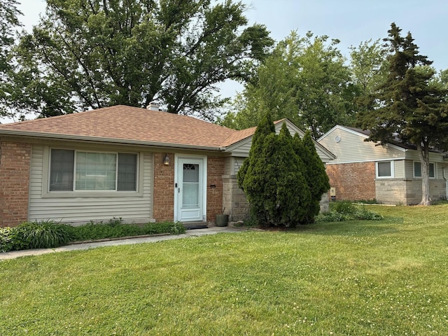 314 Meota St, Park Forest, IL 60466 - ranch-style home with a front lawn, brick siding, and roof with shingles